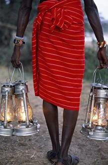Kenyan Collection: Service in the bush - kerosene lanterns light the pathway