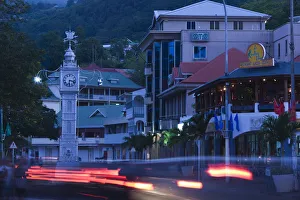 Seychelles, Mahe Island, Victoria, town clocktower and evening traffic