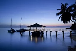 Sun Set Gallery: Seychelles, Praslin Island, Anse Bois de Rose, pier at the Coco de Mer hotel, sunset
