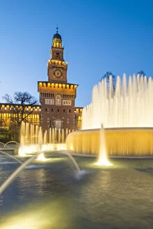 Sforzesco castle and fountain at sunset. Milan, Lombardy, Italy