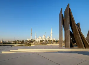 Middle East Prints: Sheikh Zayed bin Sultan Al Nahyan Grand Mosque and Wahat Al Karama Monument at sunrise