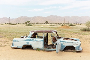 Rusty Prints: Shell of an old car at the remote settlement of Solitaire, Khomas Region, Namibia