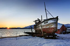 Artic Prints: Shipwreck on the shore of Tromso fiord at sunrise, troms, norway