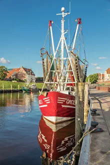 Ship Prints: Shrimp boats in the harbor of Greetsiel at sunrise, East Frisia, Lower Saxony, Germany