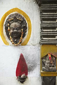 Images Dated 16th May 2013: Shrine and mask outside house, Kathmandu, Nepal