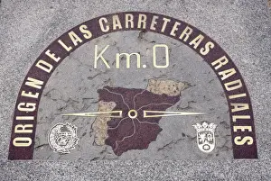 Puerta Del Sol Prints: Sign plaque on the street floor marking the kilometre zero from which all the distances
