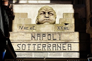 Shadow Prints: Sign and statue at the entrance of the underground Naples
