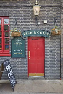 Images Dated 21st June 2022: A signboard saying 'Fish & Chips'over the door of the 'Anchor Bankside'traditional pub, Bankside