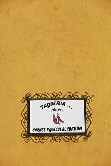 Images Dated 7th June 2022: The signboard of a traditional 'Taqueria'restaurant in a street of Izamal, Yucatan, Mexico