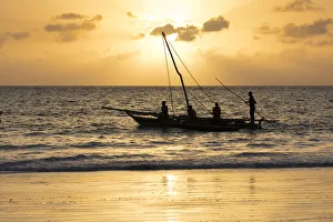 Dhow Prints: A silhouette of a dhow at sunrise, Matemwe, Zanzibar, Tanzania