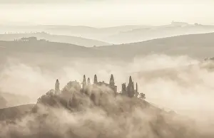 San Quirico Dorcia Prints: Silhouette of Podere Belvedere and rolling hills shrouded in mist at dawn