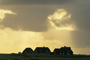Dwellings Gallery: Silhouettes of houses in dramatic light, Ellenbogen, Sylt, Nordfriesland, Schleswig-Holstein