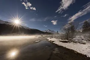 Silvaplana lake, St. Moritz, Switzerland The sun reflected in the lake Silvaplana