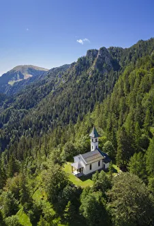 Silvestri church and the Mount Pora in a summer day. Presolana pass, Angolo Terme