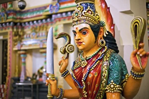Singapore, Singapore, Chinatown. Hindu guardian statue at the Sri Mariamman Temple