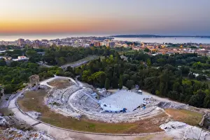 Ortigia Prints: Siracusa, Sicily. Aerial view of the Roman theater with Ortigia island in the background