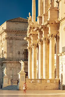 Ortigia Prints: Siracusa, Sicily. A woman walking on the square with the Cathedral in the background