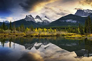 Three Sisters Reflecting in Bow River, Banff National Park, Alberta, Canada