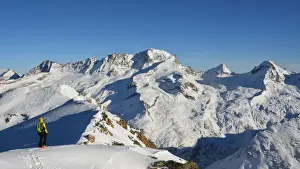 Skier Prints: Ski mountaineers with Grand Paradiso on background (from Entrelor summit), Rhemes Valley