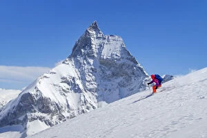 Skier and Matterhorn mountain in the background, Zermatt, Switzerland