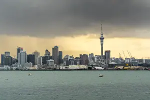 Skyline of Auckland Central Business District under a gloomy sky at sunrise. Auckland City, Auckland region