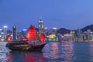 Hong Kong Prints: Skyline of Hong Kong Island and junk boat at dusk, Hong Kong