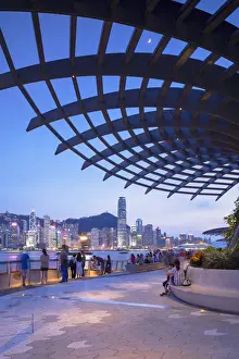 The City At Night Prints: Skyline of Hong Kong Island and Tsim Sha Tsui promenade at sunset, Hong Kong