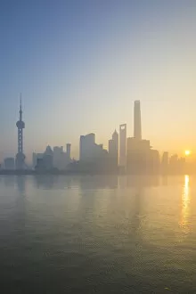 Skyline of Pudong from The Bund on a foggy November morning, Shanghai, China