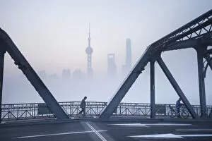 Skyline of Pudong & the Waibaidu bridge on a foggy November morning, Shanghai, China