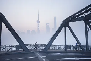 Skyline of Pudong & the Waibaidu bridge on a foggy November morning, Shanghai, China Skyline of Pudong & the Waibaidu bridge on a foggy November morning, Shanghai, China