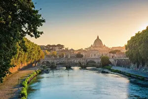 Tiber Prints: The skyline of Rome seen from the Tiber river at sunset. Rome, Lazio, Italy
