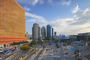 Vehicles Prints: Skyscrapers and traffic outisde Seoul Station, Seoul, South Korea