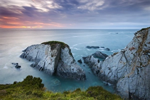 Slate cliffs near Morte Point at sunset, Mortehoe, North Devon, England. Summer
