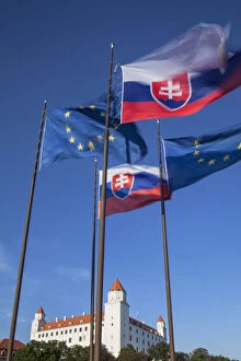 Images Dated 20th November 2013: Slovakian and European Union flags of Parliament with Bratislava Castle, Bratislava