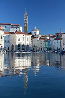 Adriatic Sea Prints: Slovenia, Piran, the church and old town reflected in the sea