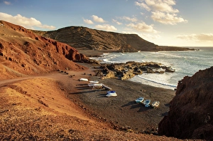 Lanzarote Prints: Small boats on the black sand beach at El Golfo, Lanzarote, Canary Islands, Spain
