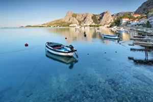 Small boats moored on the waterfront of Omis, Dalmatia, Adriatic Coast, Croatia