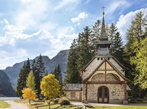 Small chapel on Lake Braies in autumn, South Tyrol, Italy