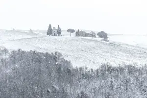 Rolling Hills Prints: The small chapel of Madonna di Vitaleta appearing in the blizzard during a winter