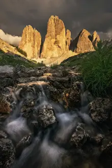Trek Prints: A small stream comes down from the Tre Cime di Lavaredo during a summer sunset