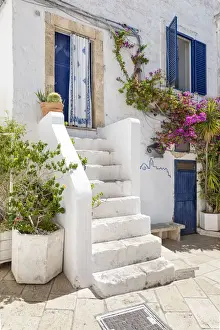 Small street in the white village of Ostuni (province of Brindisi, Salento, Apulia)