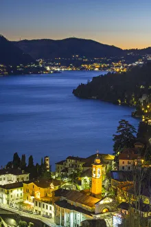Small towns on the banks of Como lake at dusk. Como, Lombardy, Italy Small towns on the banks of Como lake at dusk. Como, Lombardy, Italy