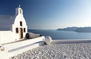 Small Prints: Small traditional Greek whitewashed church with caldera view
