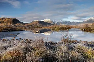 March Prints: Snow capped mountain reflections in Lochan na h-Achlaise on a frosty winter morning in Rannoch Moor