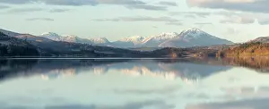 Symmetry Prints: Snow-capped mountains reflected in Loch Garry, Lochaber, Scotland, February 2025