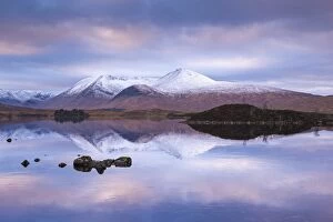 Serene Landscapes Gallery: Snow Covered Black Mount reflected in a lochan, Rannoch Moor, Highland, Scotland