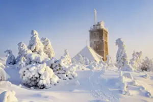 Winter Forest Prints: Snow-covered Fichtelberghaus in the evening in winter on the Fichtelberg mountain