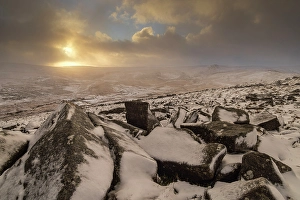 January Prints: Snow covered granite rocks at dawn