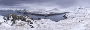 April Prints: Snow covered mountain scenery above Funningsfjordur on the island of Eysturoy