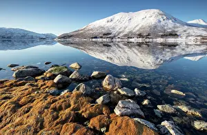 Snow Covered Prints: Snow-covered mountains with a perfect reflection in flat calm waters